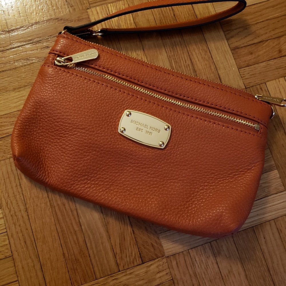burnt orange Michael Kors wristlet